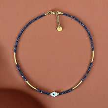 Load image into Gallery viewer, Protection &amp; Clarity Necklace – Mother of Pearl Hamsa with Blue Crystals
