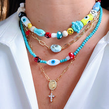 Load image into Gallery viewer, Model wearing St Michael Archangel Cross Necklace.
