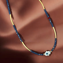 Load image into Gallery viewer, Protection &amp; Clarity Necklace – Mother of Pearl Hamsa with Blue Crystals
