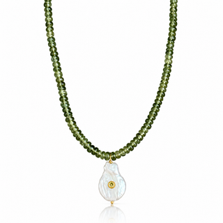 Close-up of baroque pearl pendant with lemon cubic zirconia accent and delicate green apatite rondelle beads.