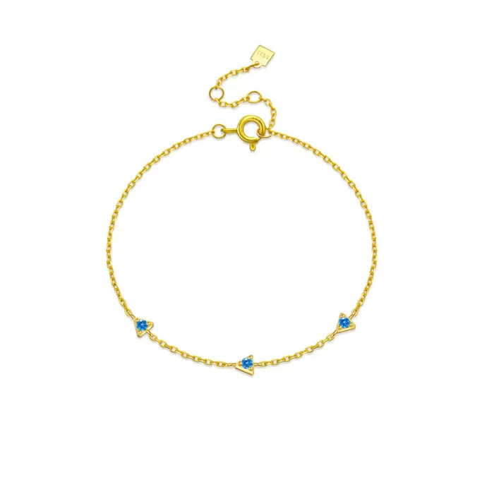 Blue Cz Triangle Chain Bracelet with a triangular charm set in 18k gold-plated sterling silver.