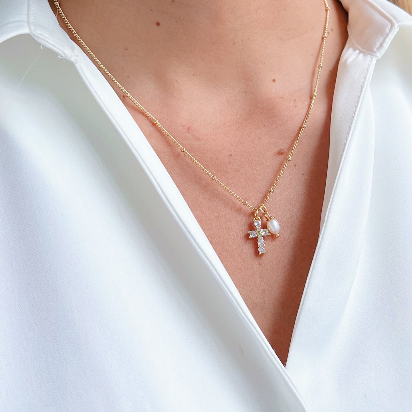 Cross Necklace featuring a delicate cubic zirconia cross with a freshwater pearl pendant, elegant and perfect for any occasion.