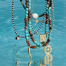 Load image into Gallery viewer, Close-up of Yin Yang pearl necklace with 8mm mother of pearl pendant.
