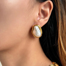 Load image into Gallery viewer, Model wearing baroque pearl earrings with gold accents, exuding elegance and timeless style
