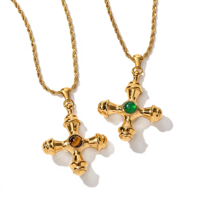 Close-up of Tiger Eye stone cross pendant symbolizing strength and guidance