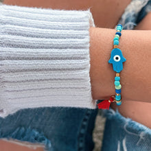 Load image into Gallery viewer, I Attract Protection and Positive Energy — Blue Hamsa Evil Eye Bracelet - Georgina Nicol
