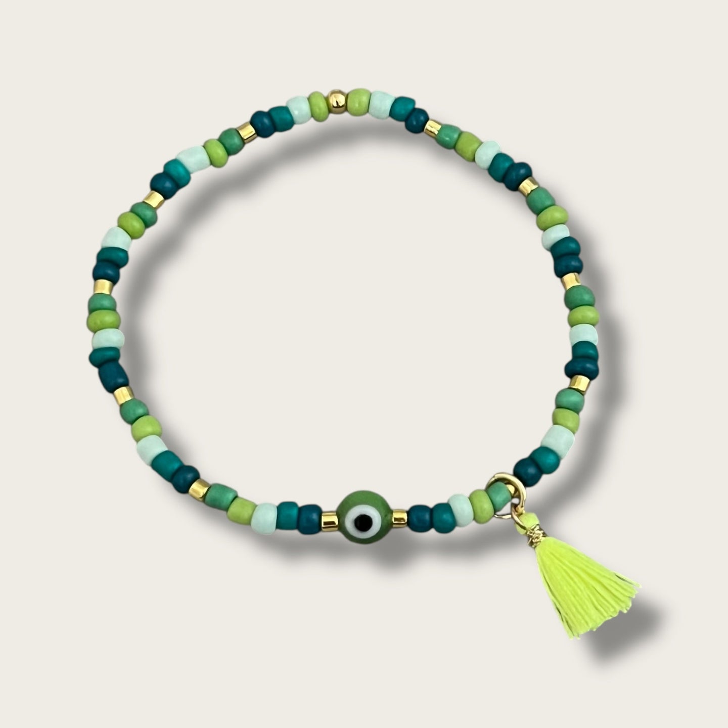 I carry balance and healing energy — Green Evil Eye Beaded Bracelet - Georgina Nicol