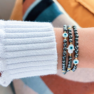 I Radiate Divine Protection and Elegance — Hematite Evil Eye & Hamsa Convertible Stretch Necklace - Bracelet - Georgina Nicol