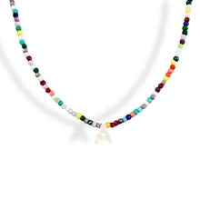 Load image into Gallery viewer, Close-up of initial name pendant with Mother of Pearl and multicolor beads.
