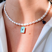 Load image into Gallery viewer, Model wearing the Blue Square Pearl Necklace, showcasing its elegant and versatile style.
