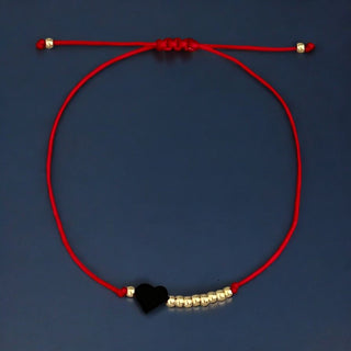 Protected by Love and Strength — Azabache Heart Red String Bracelet - Georgina Nicol