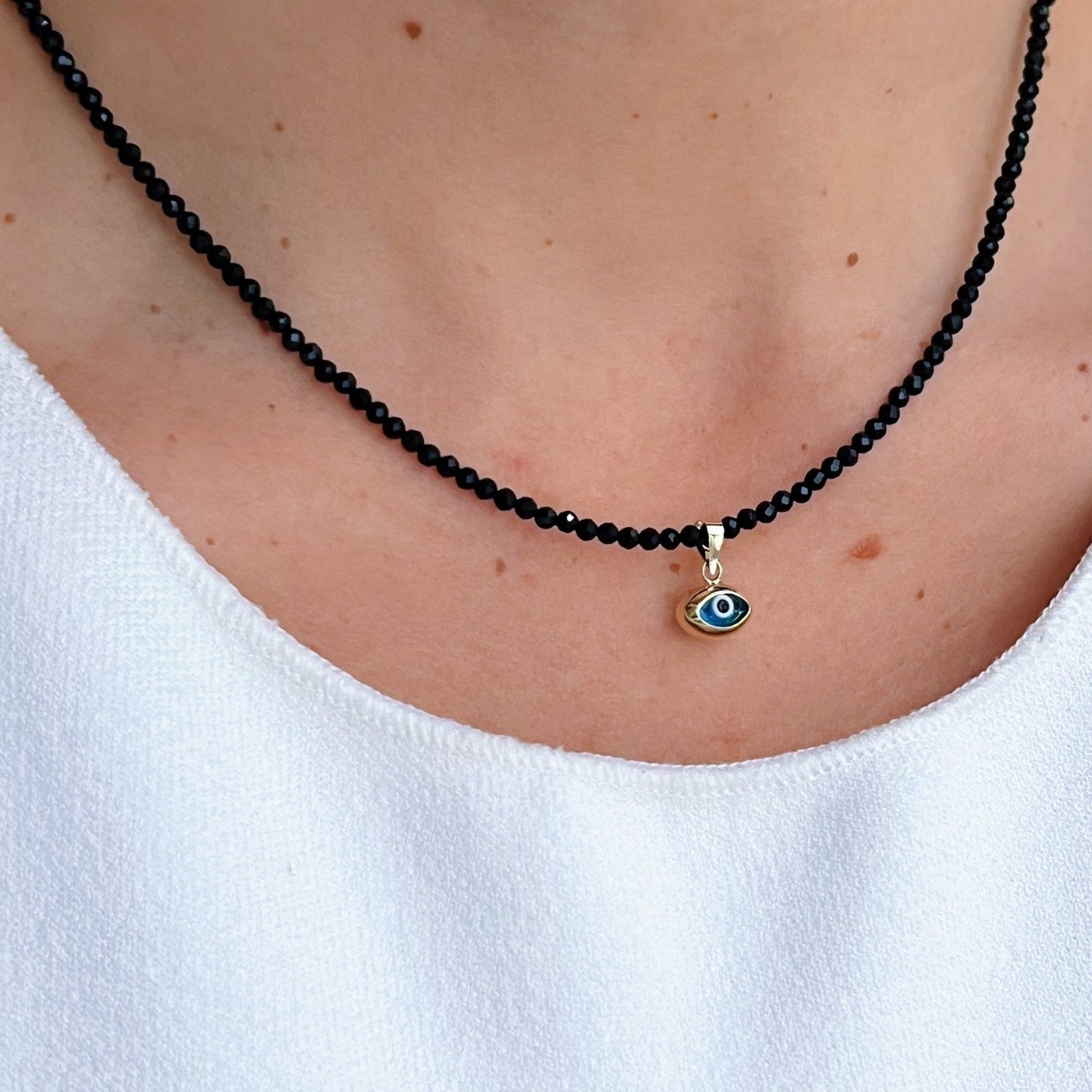 Warding Off Negativity - Black Spinel Necklace with 14K Solid Gold Evil Eye - Georgina Nicol